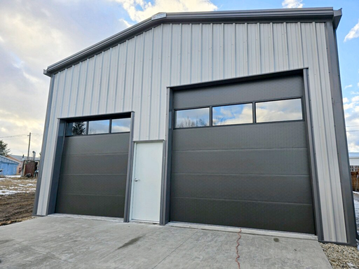 Steel garage with two overhead doors